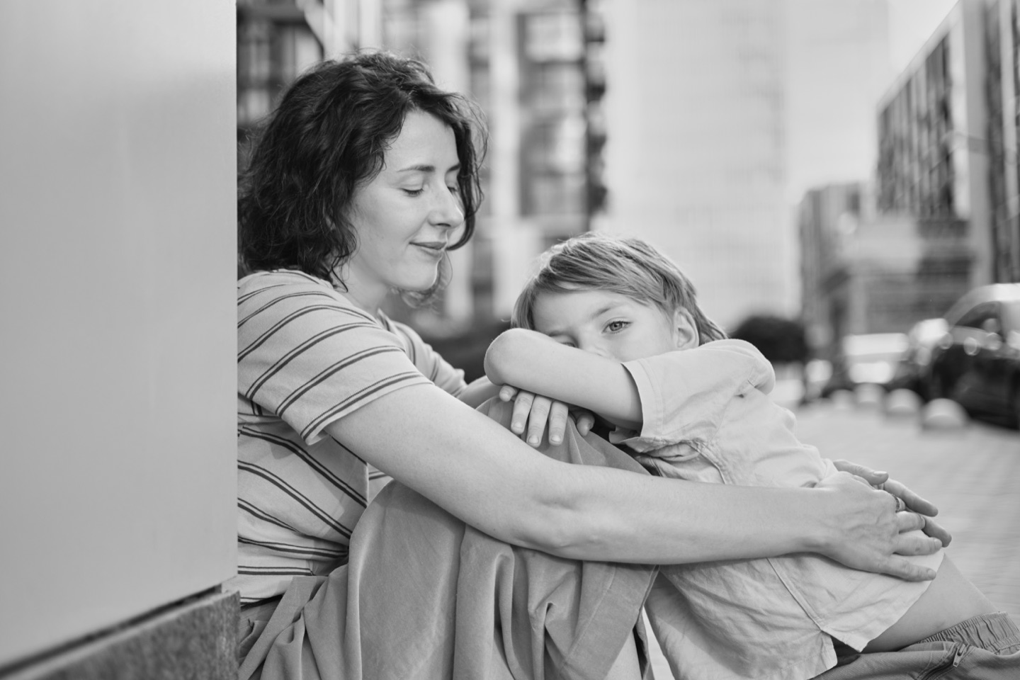 A mother holding her child close