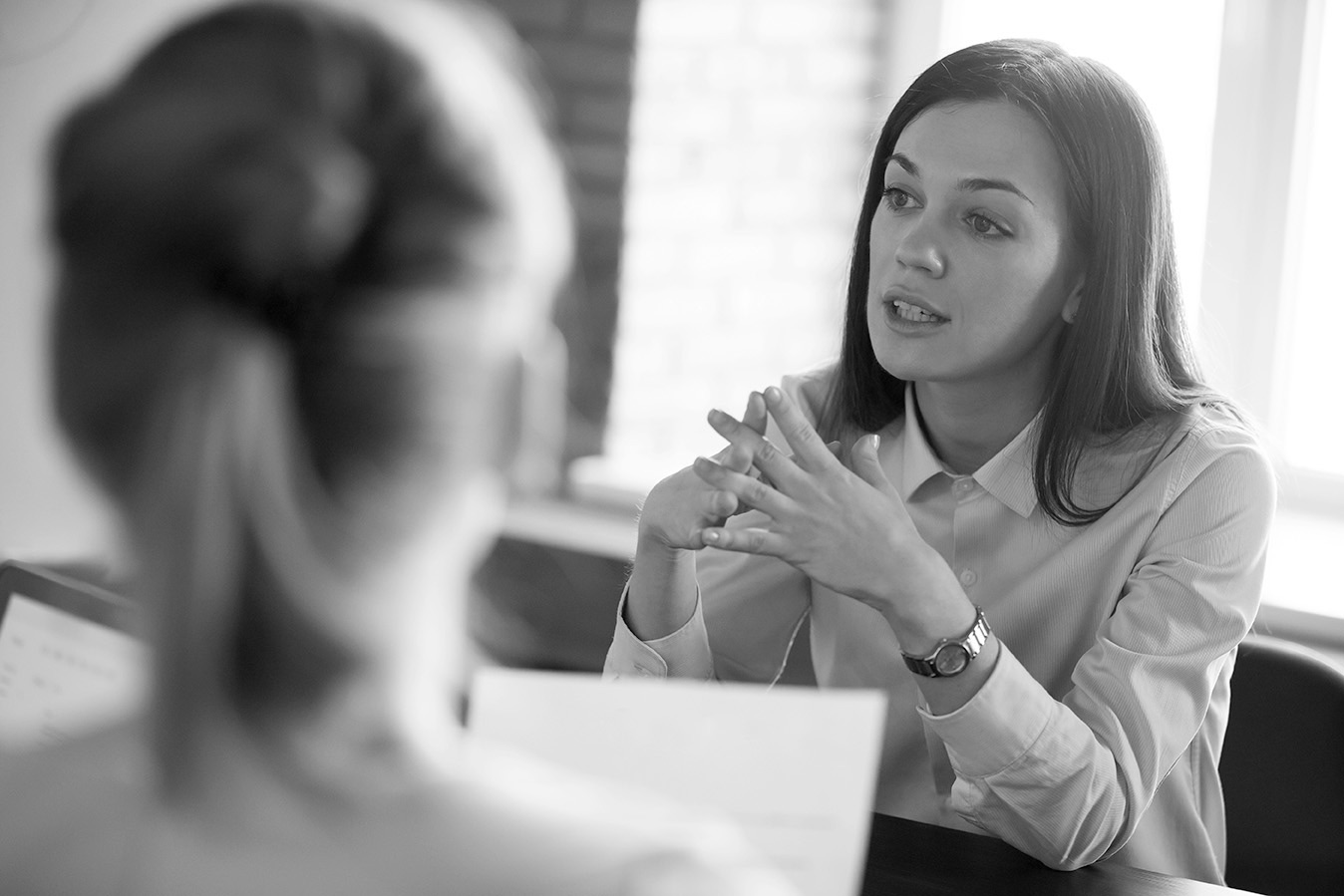 A woman discussing her situation during a consultation